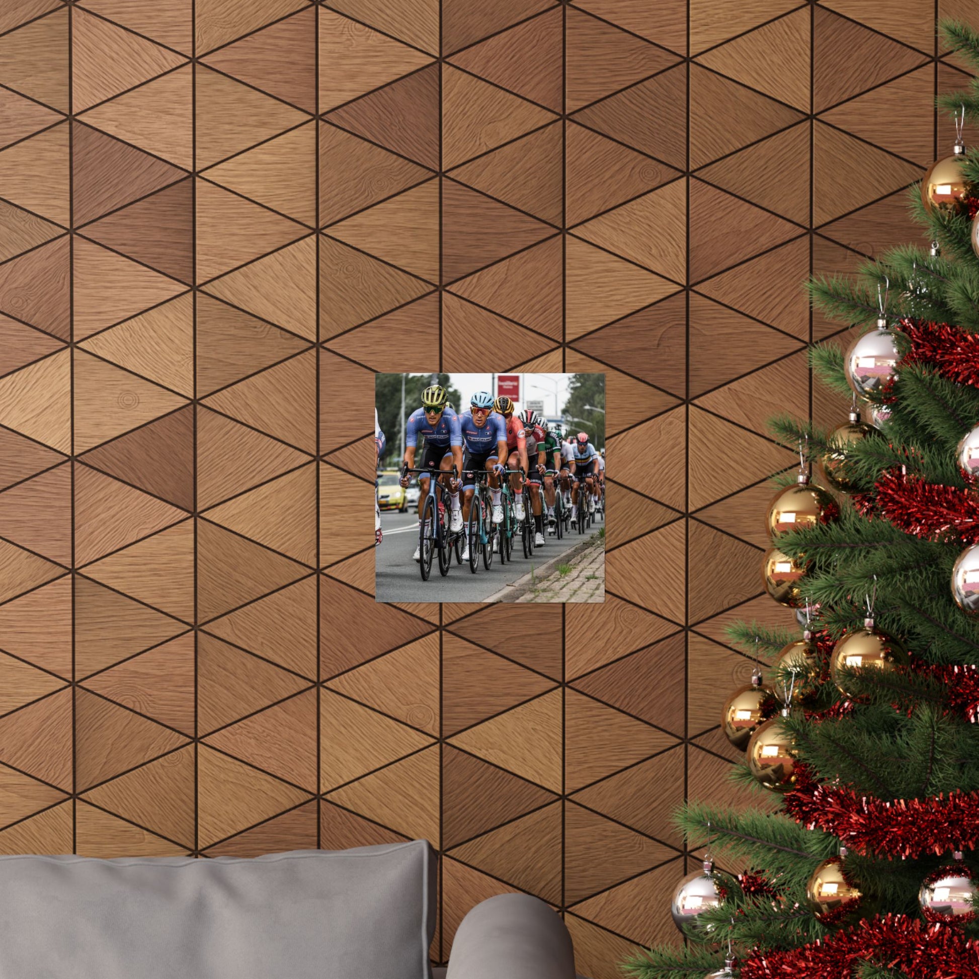 Wooden wall with geometric pattern, inset photo of cyclists, and Christmas tree with decorations.