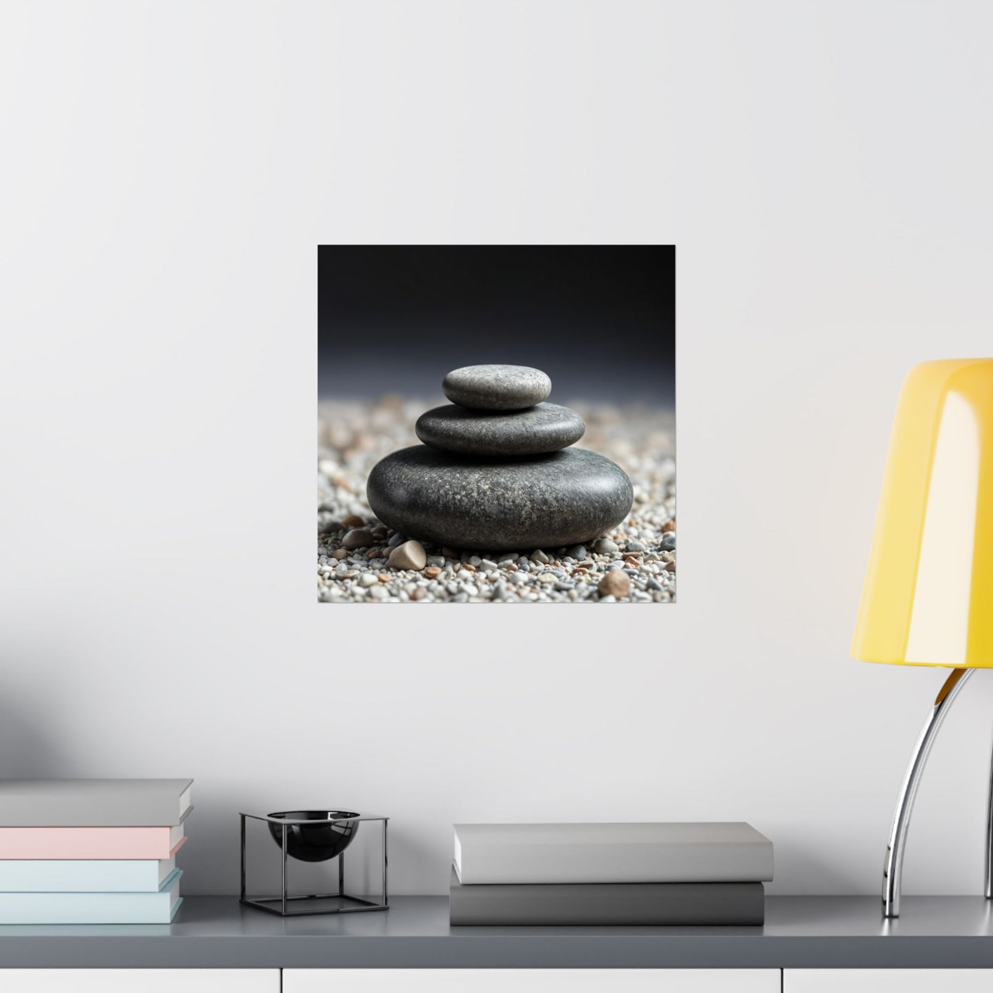 Stylized image of stacked stones on a pebble beach with a modern interior setting.