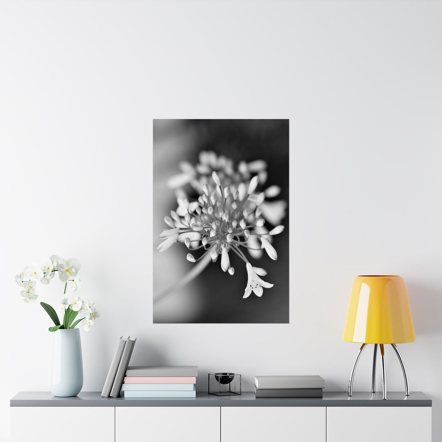 Floral artwork on a wall above a table with decor items