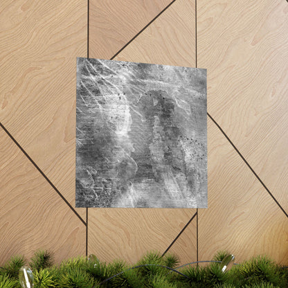 Gray textured square on a wooden floor with green plants at the bottom