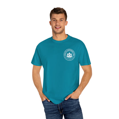 Man wearing a teal t-shirt with a logo on a white background