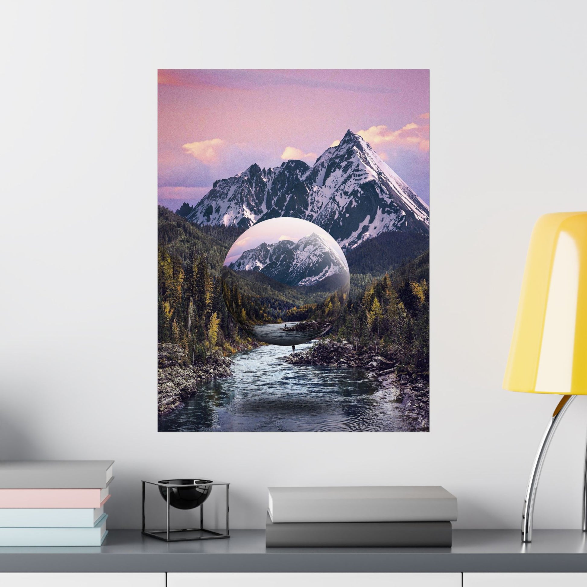 Framed artwork of a mountain landscape with a reflective lake on a wall above a shelf.