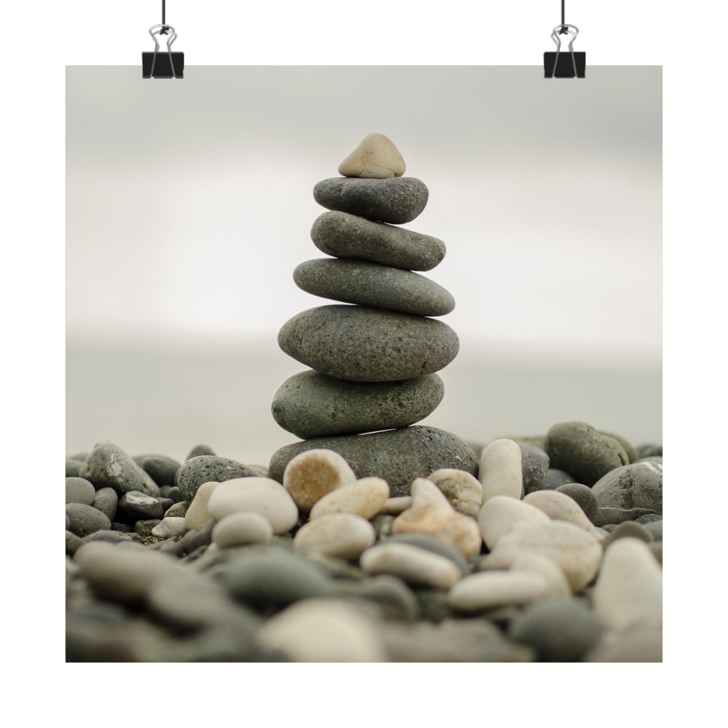 Stack of stones on a beach with a plain background
