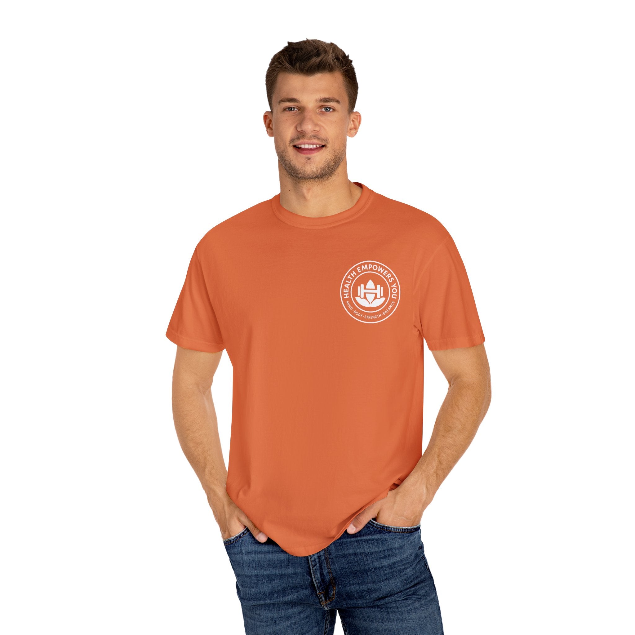 Man wearing an orange t-shirt with a logo on a white background