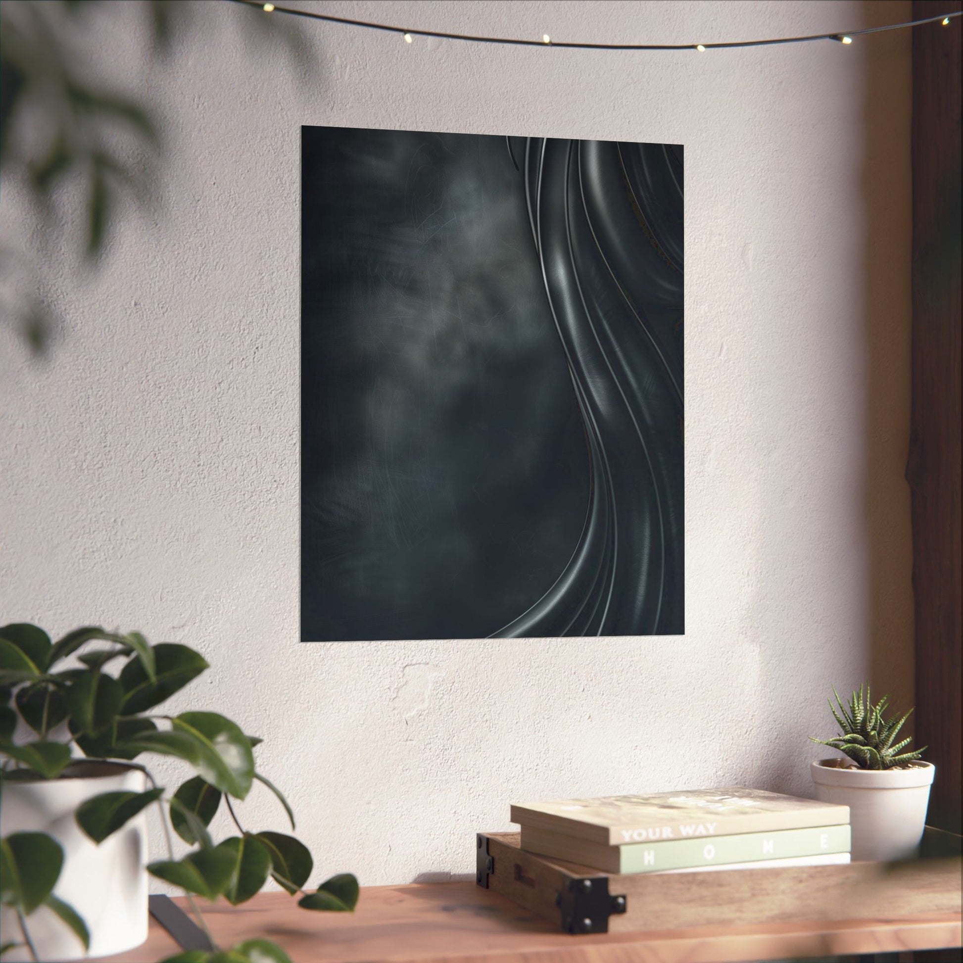 Abstract wall art on a white wall with a wooden table and plants below.