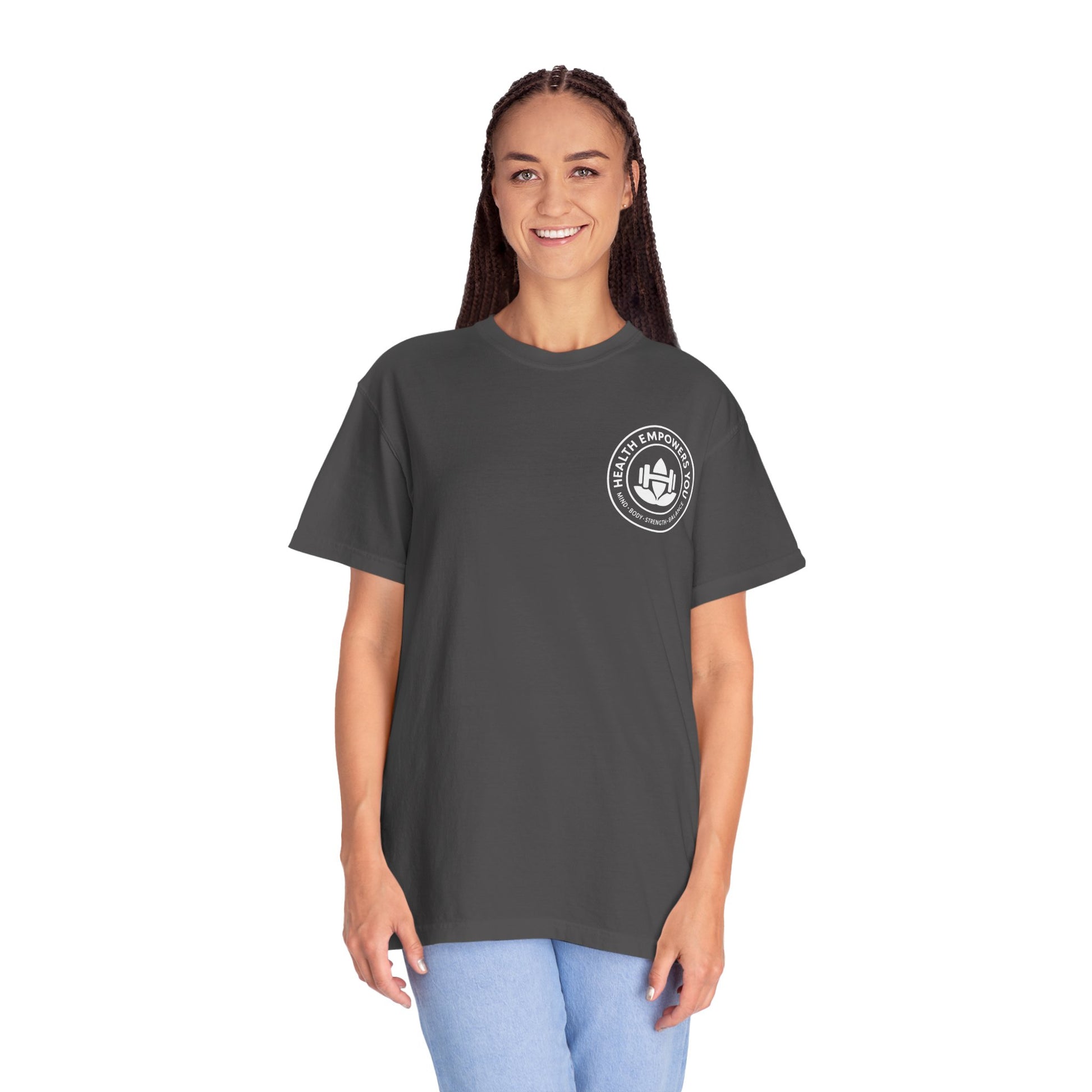 Person wearing a dark gray t-shirt with a logo on a white background