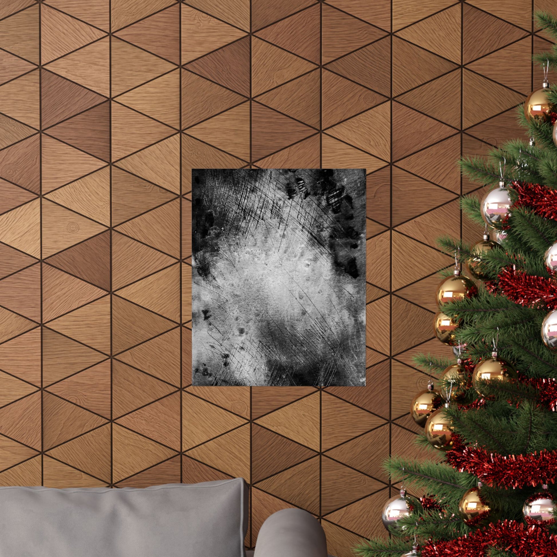 Wooden wall with geometric pattern, framed picture, and Christmas tree with decorations.