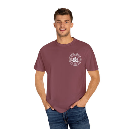 Man wearing a maroon t-shirt with a logo on a white background