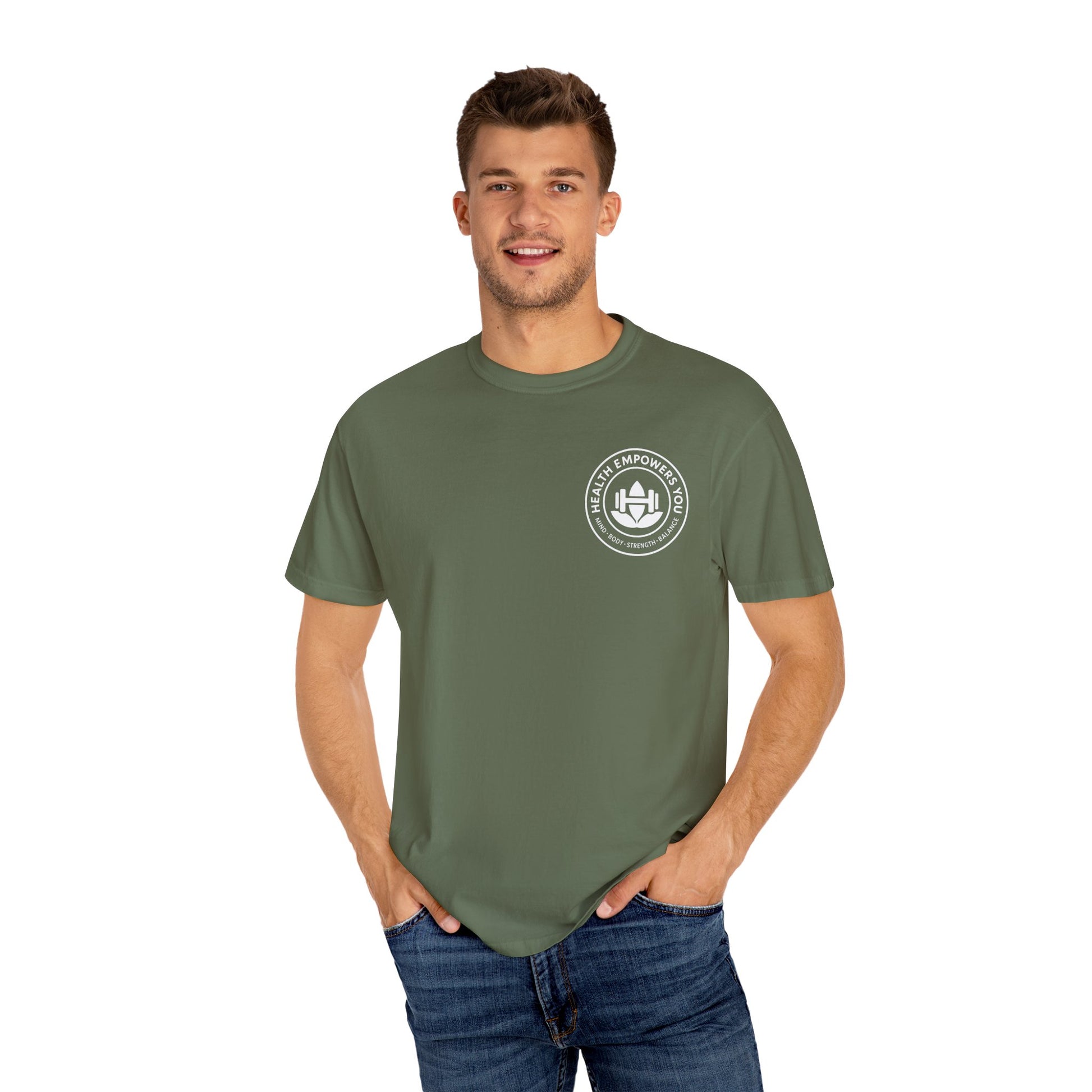 Man wearing a green t-shirt with a logo on a white background
