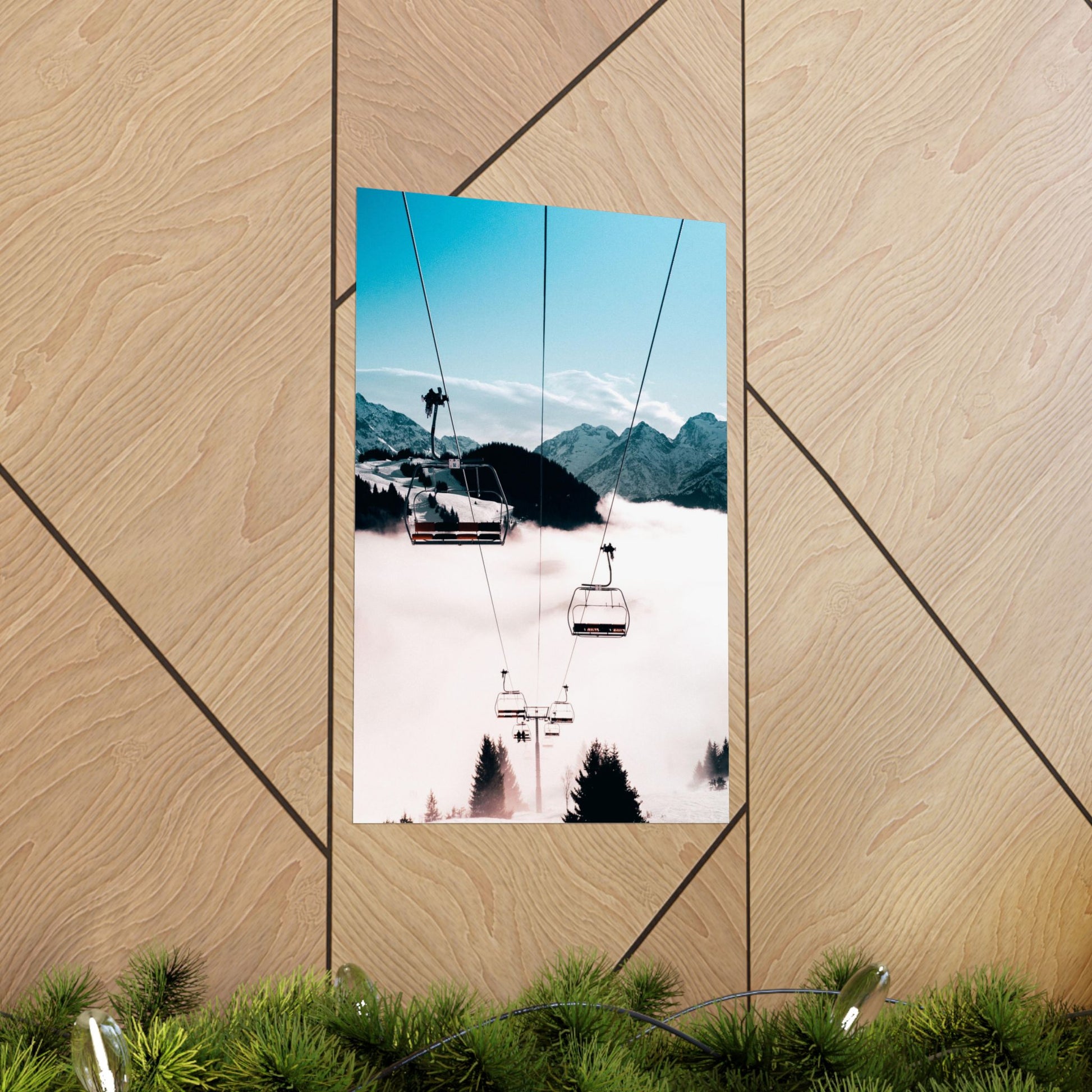 Ski lift with mountains in the background on a wooden panel