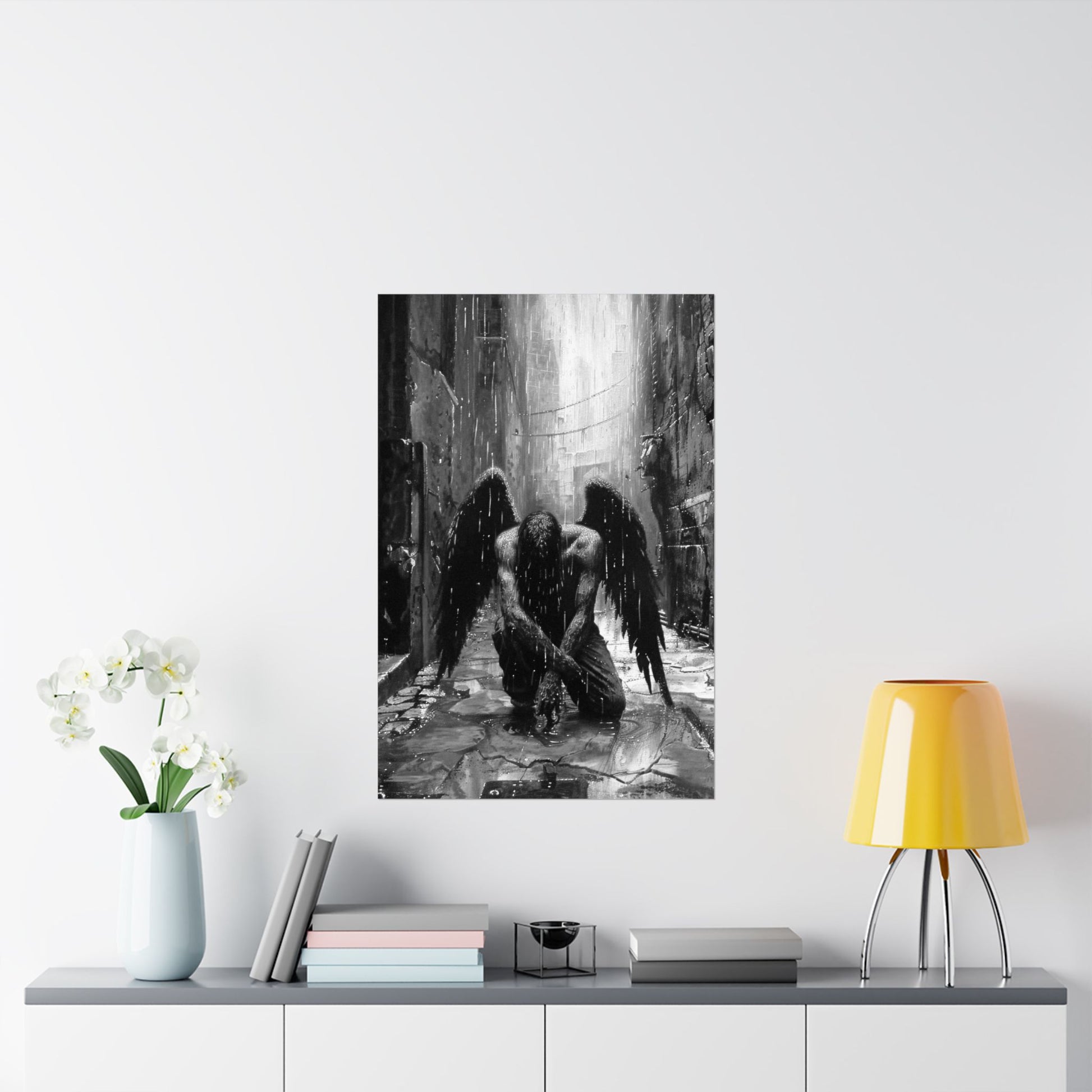 Framed artwork of an angel in a dark alleyway on a wall above a shelf with decor items.