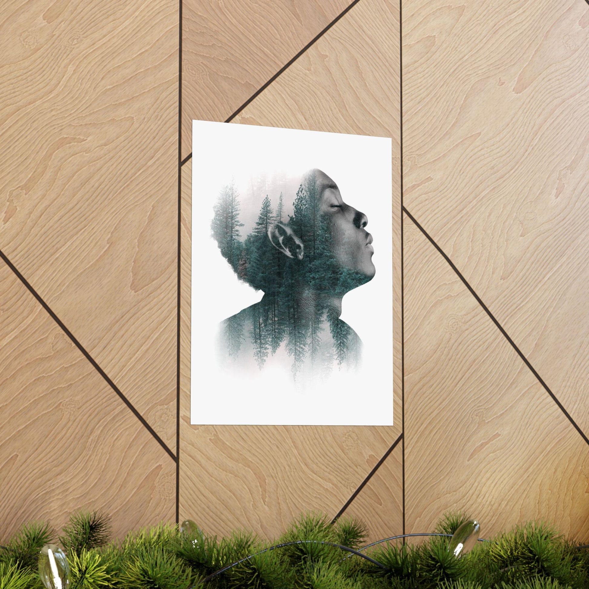 Art print of a person with trees inside their head on a wooden wall.