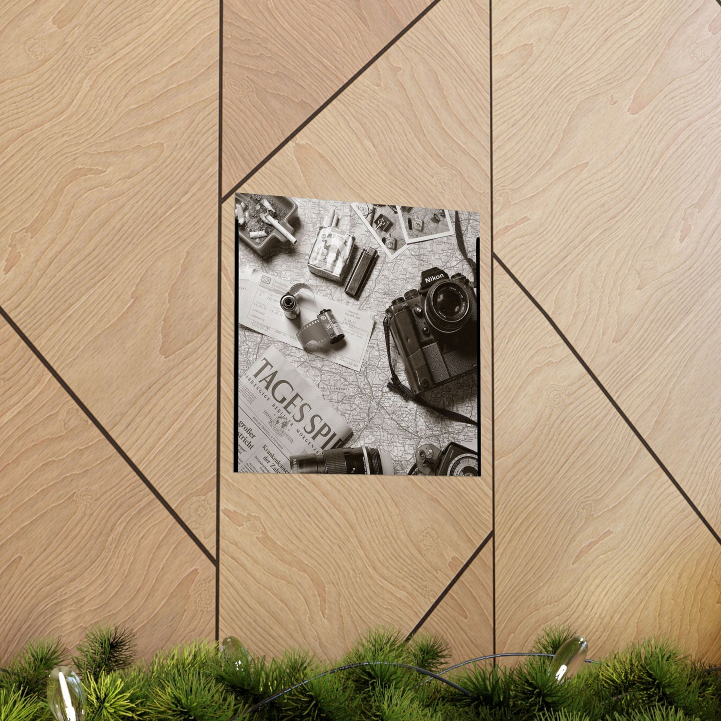Framed black and white photo of vintage camera and items on a wooden surface