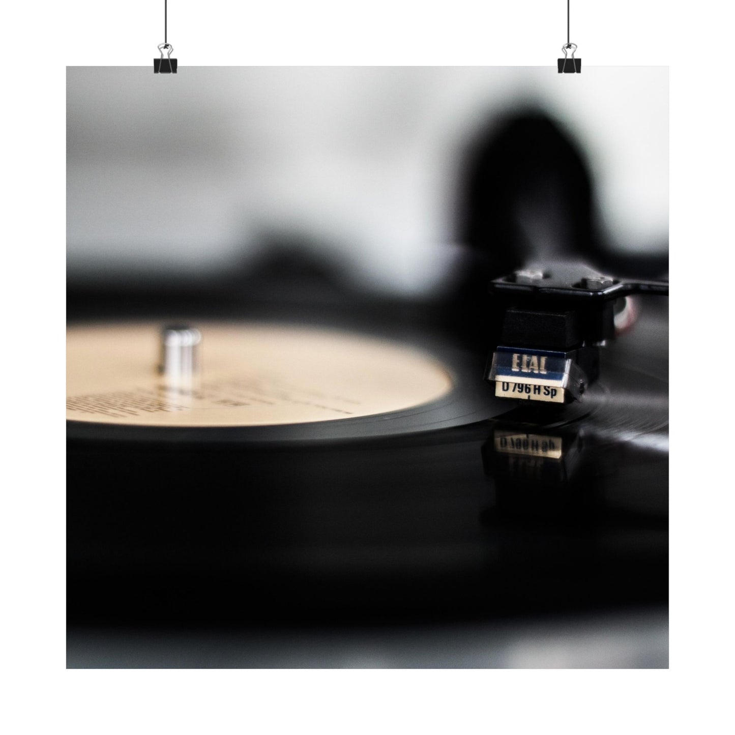 Record player with a vinyl record on a dark surface