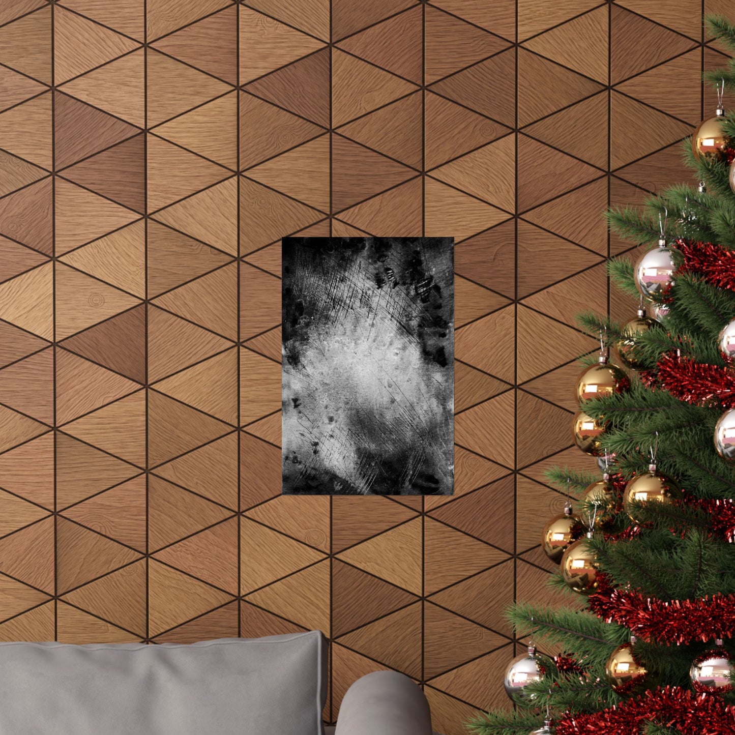 Wooden wall with geometric pattern, framed black and white abstract art, and a decorated Christmas tree.