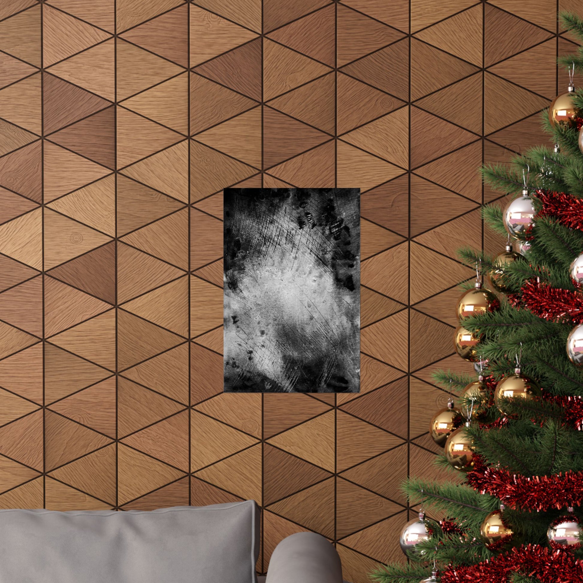 Wooden wall with geometric pattern, framed black and white abstract art, and a decorated Christmas tree.