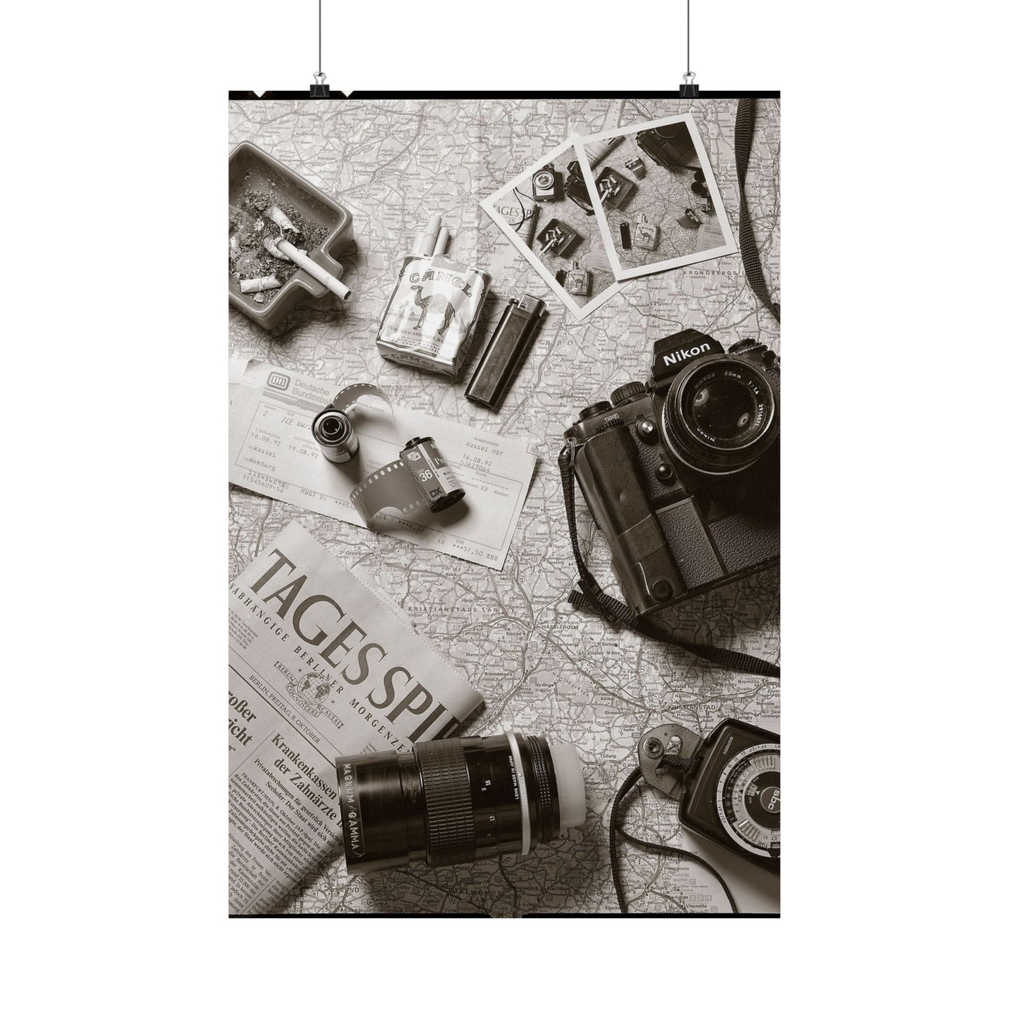 Vintage camera and accessories on a map with 'Tages-Spiegel' newspaper