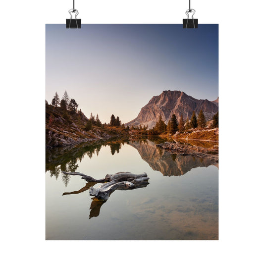 Mountain landscape with a lake and trees at sunset