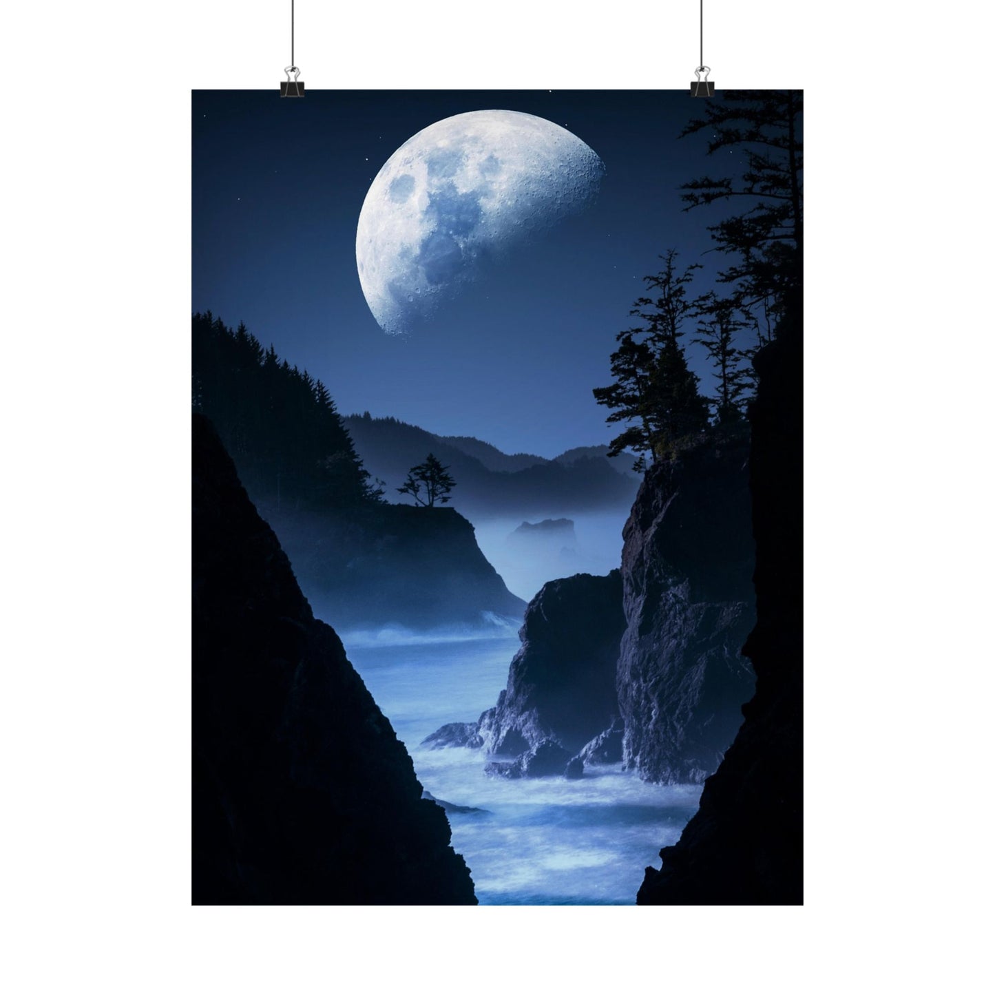 Poster of a moonlit landscape with cliffs and trees, hanging on a white background.