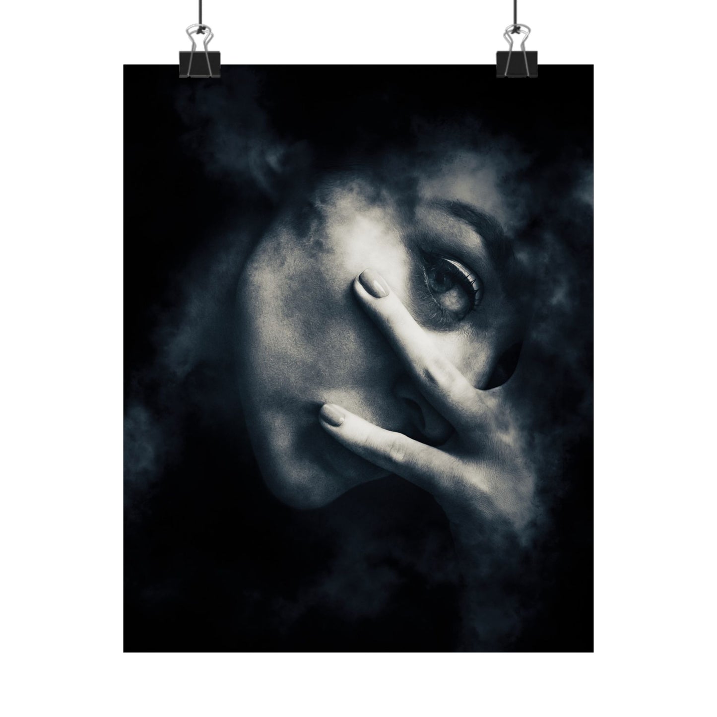 Black and white artwork of a face with a hand covering one eye, hanging on a white wall.