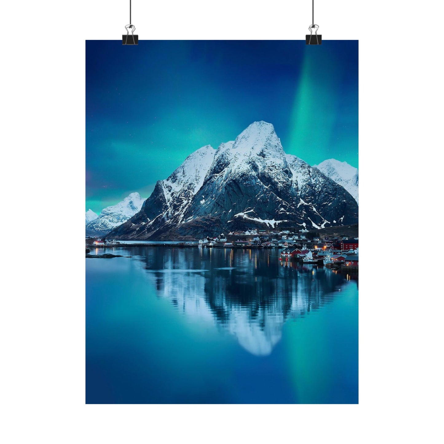 Mountain reflection in water with aurora borealis in the sky