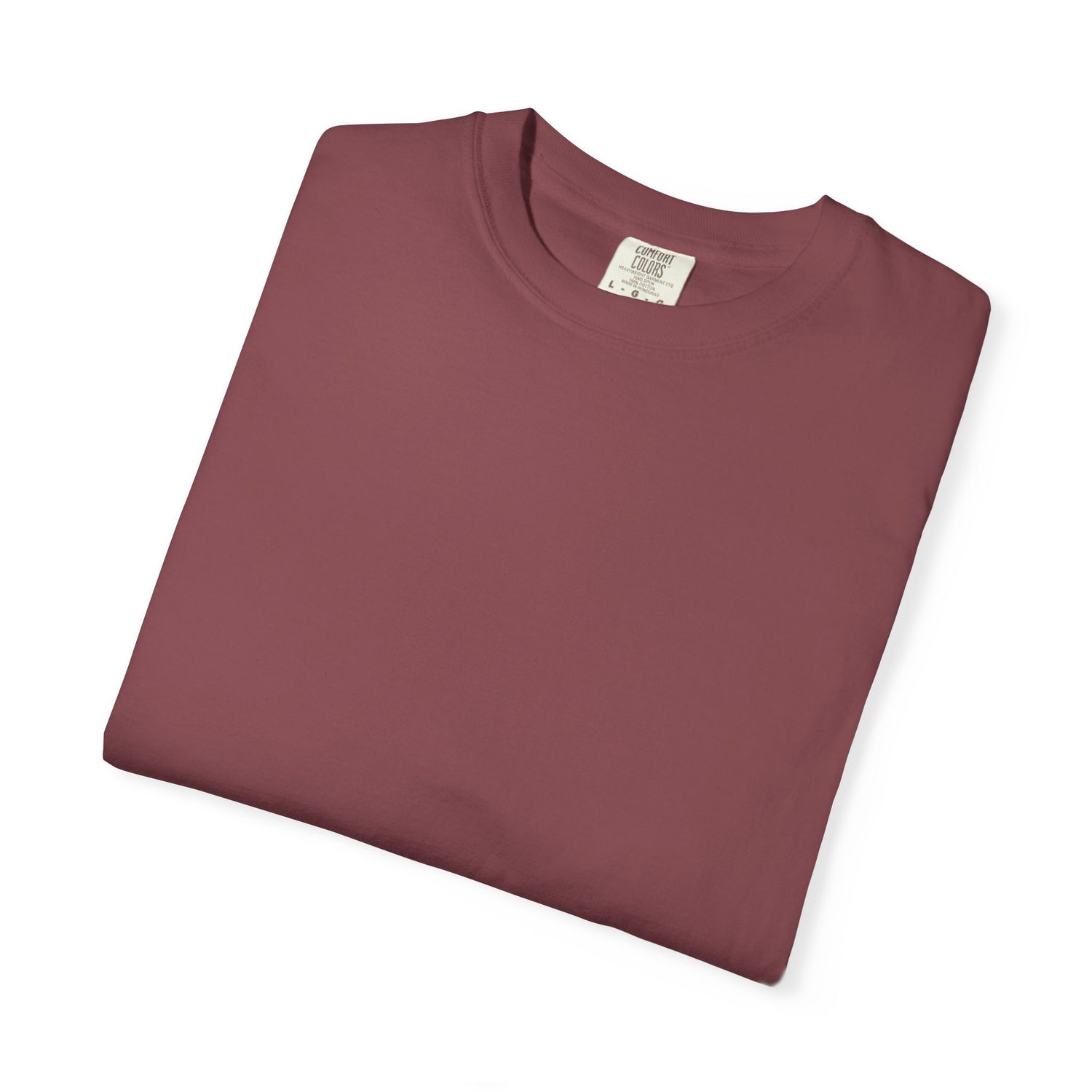 Folded maroon t-shirt with a label on a white background