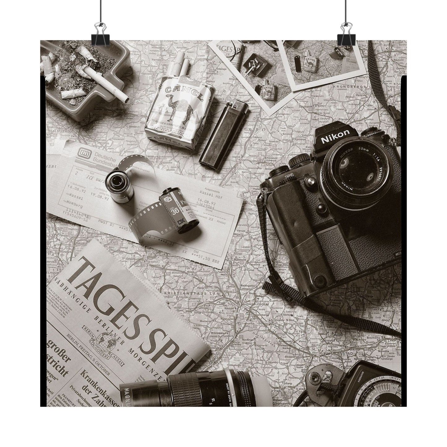 Vintage camera and accessories on a map background