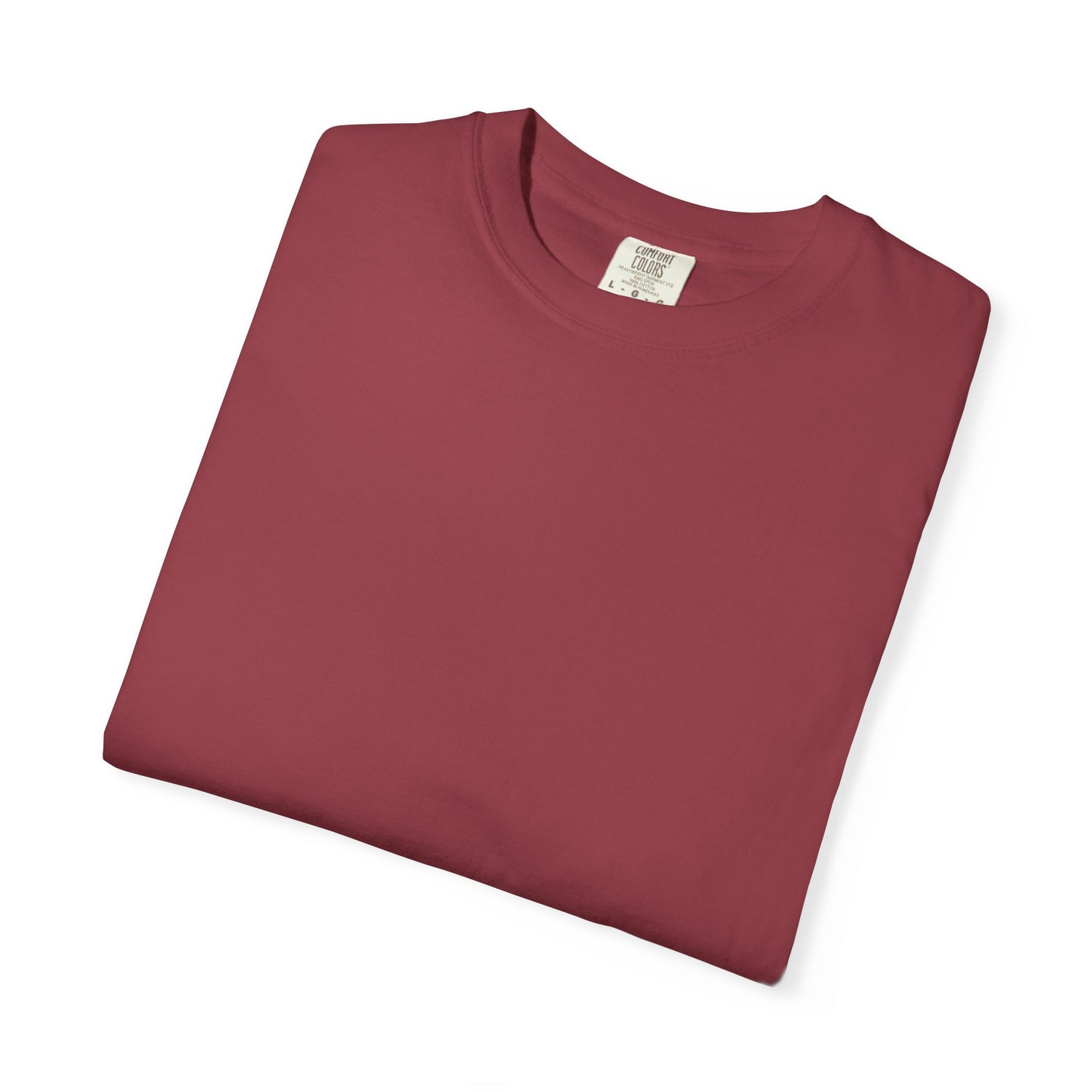 Folded maroon t-shirt with a label on a white background