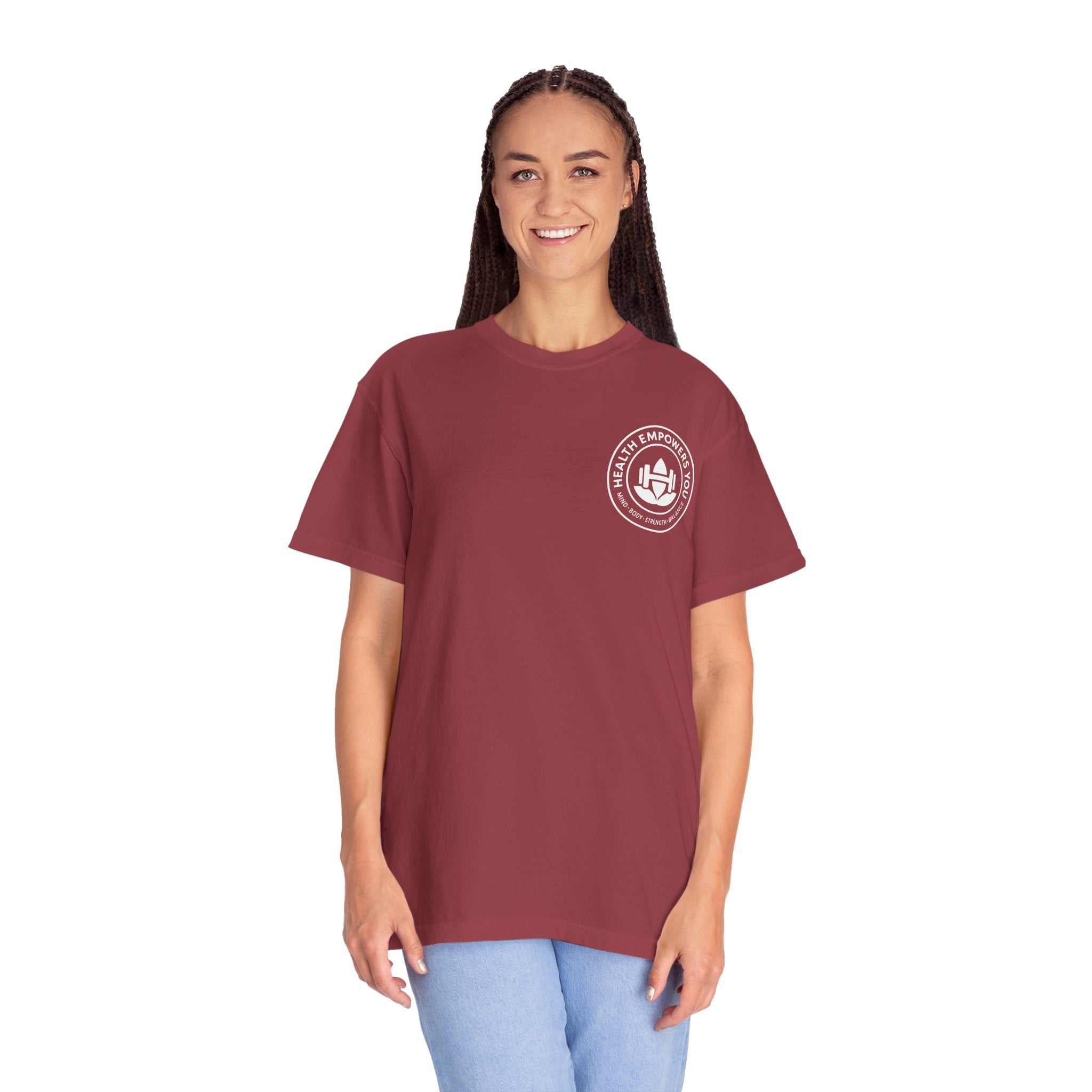 Person wearing a maroon t-shirt with a logo on a white background
