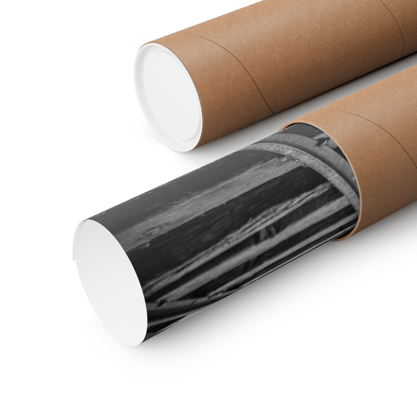 Two cardboard tubes with one containing black and white striped paper on a white background