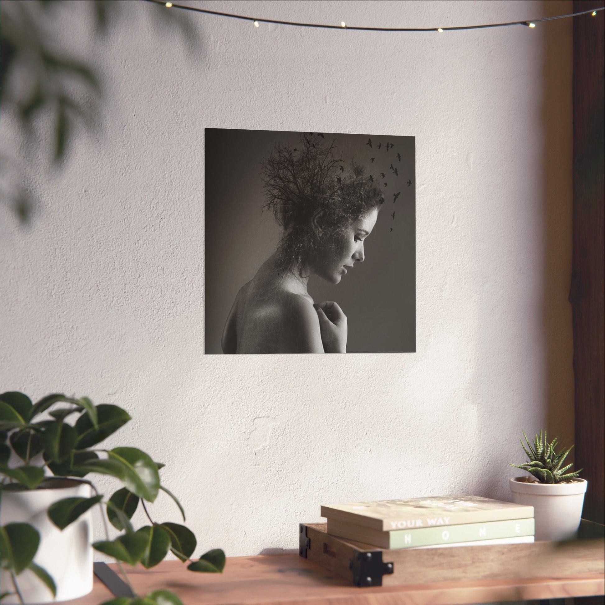 Wall art of a woman with nature elements in a room with plants and books.