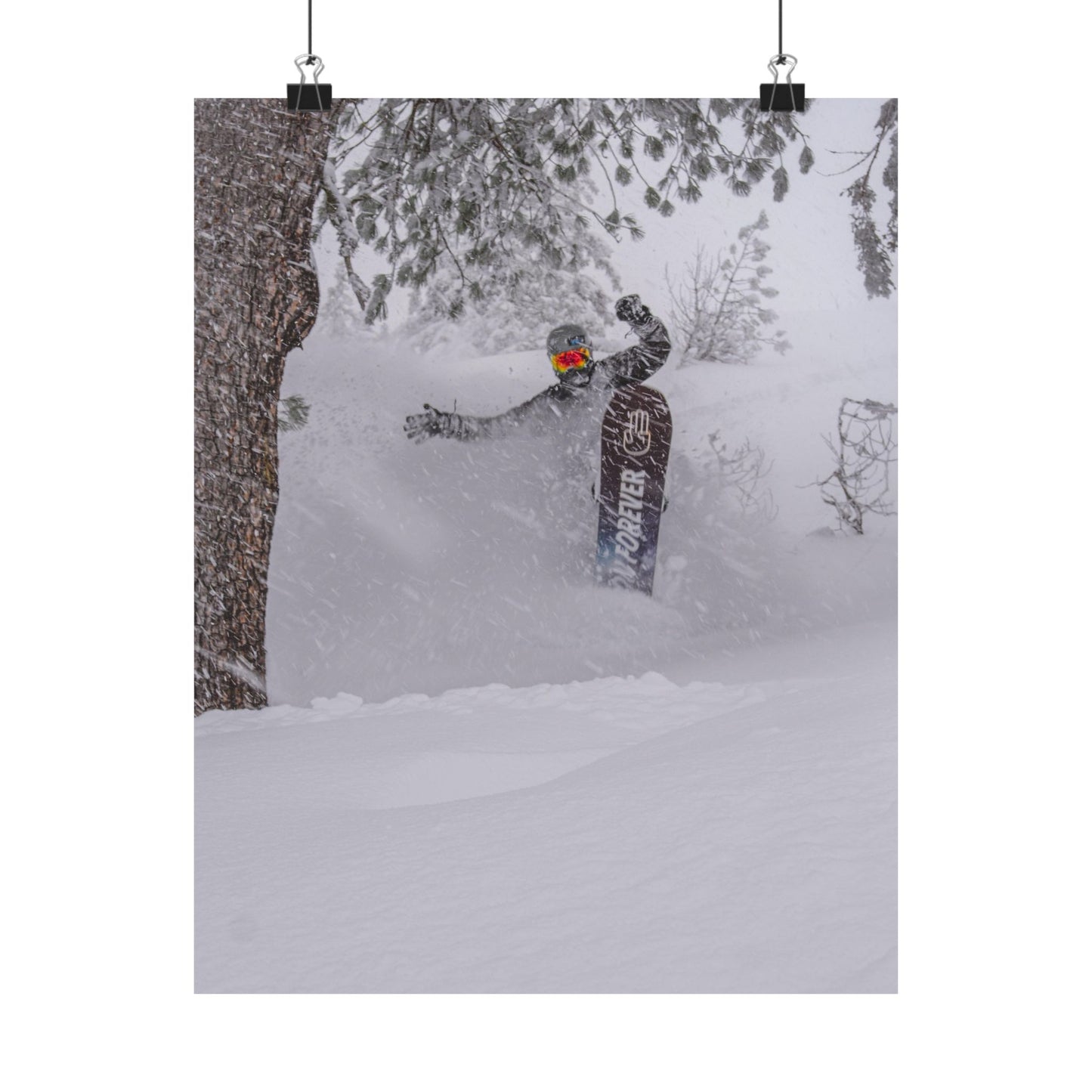Person snowboarding in a snowy forest with a backpack labeled 'Backcountry' on a white background
