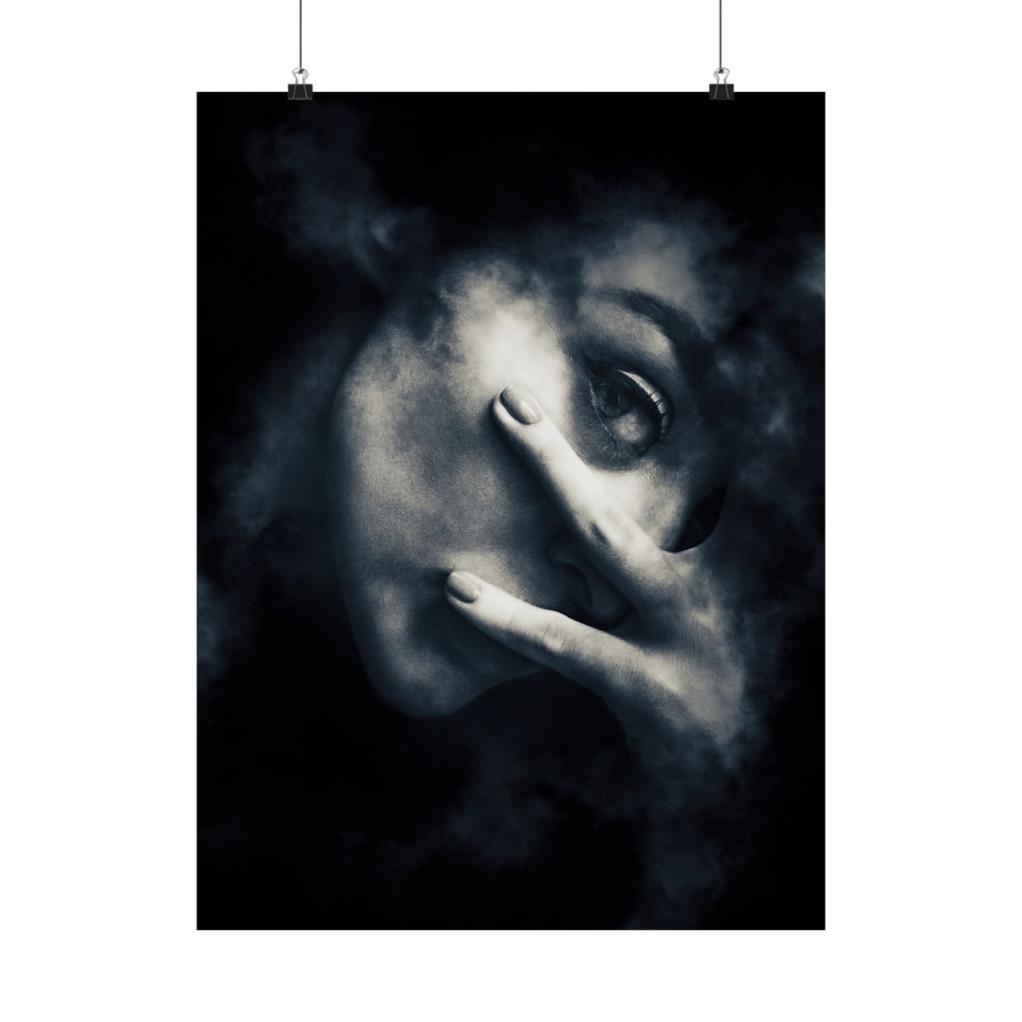 Black and white artwork of a face with a hand covering part of it, hanging on a white wall.