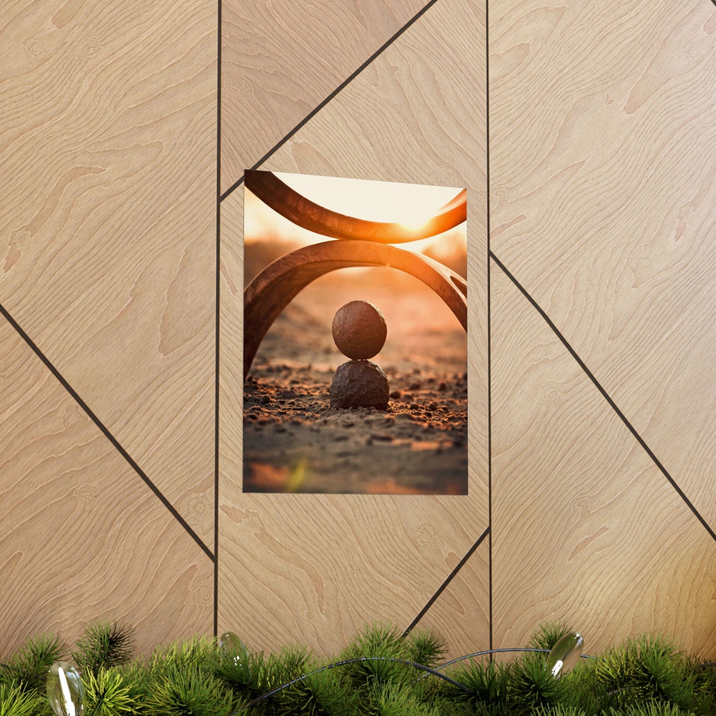 Decorative mirror with geometric design on a wooden wall, reflecting a sunset scene.
