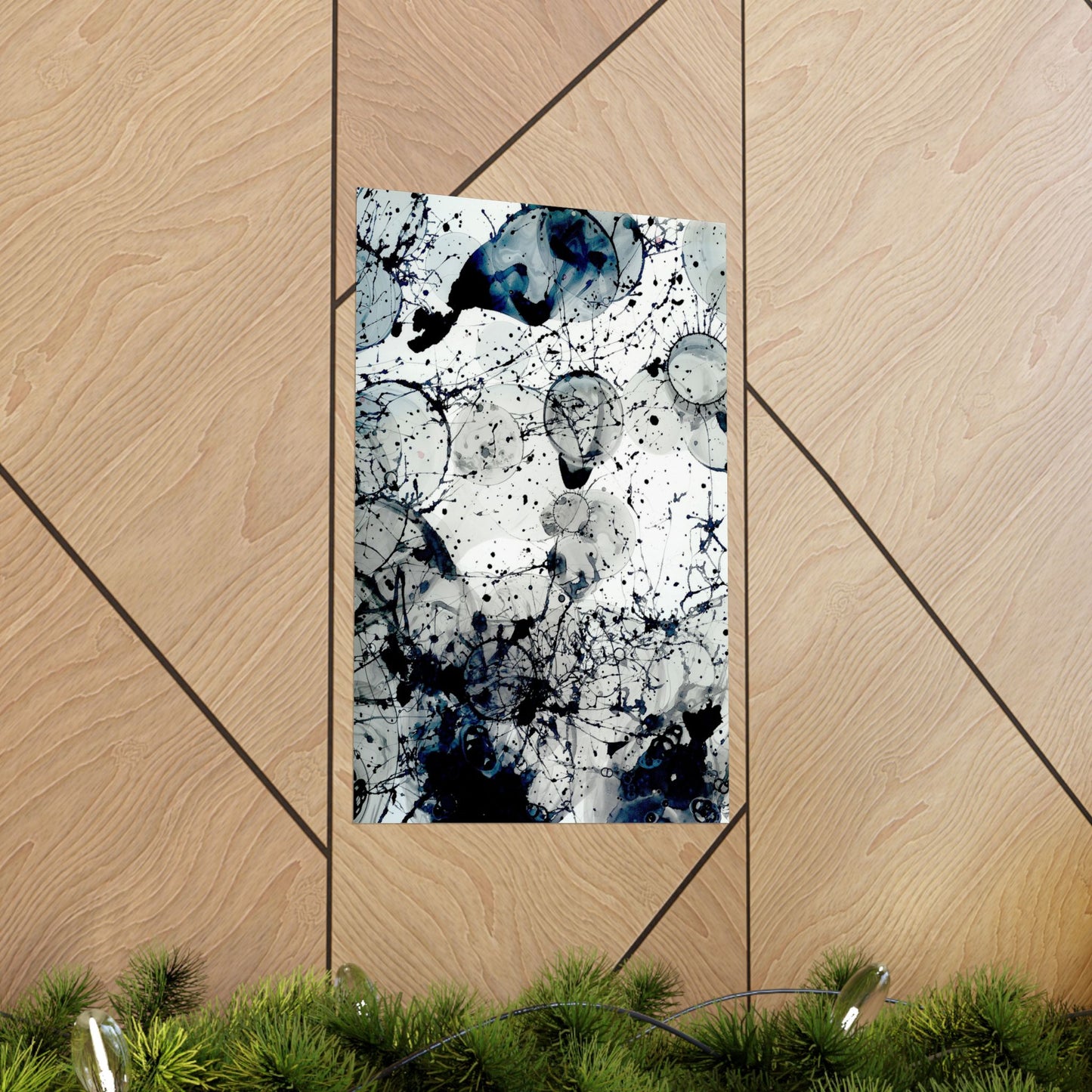 Abstract art print with black and white splashes on a wooden panel