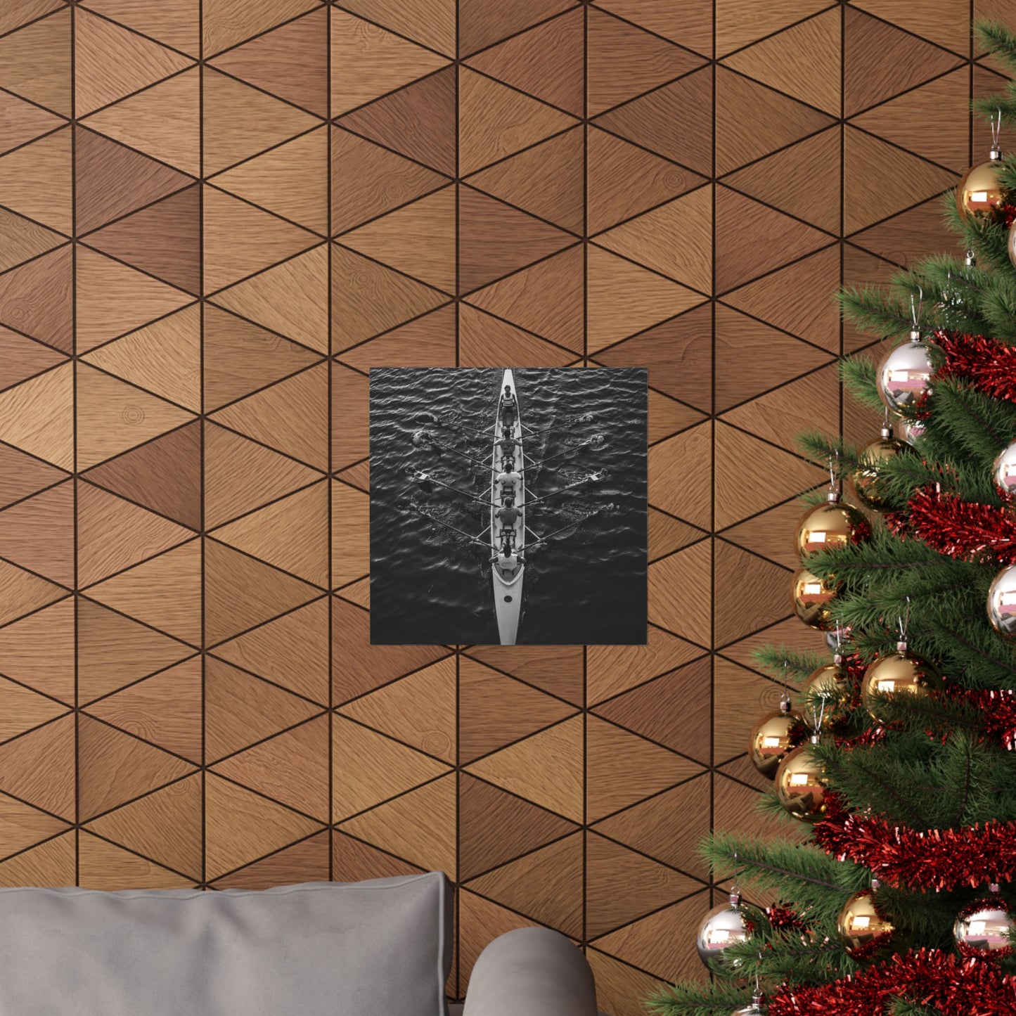 Wooden wall with geometric pattern, framed artwork, and Christmas tree with decorations.