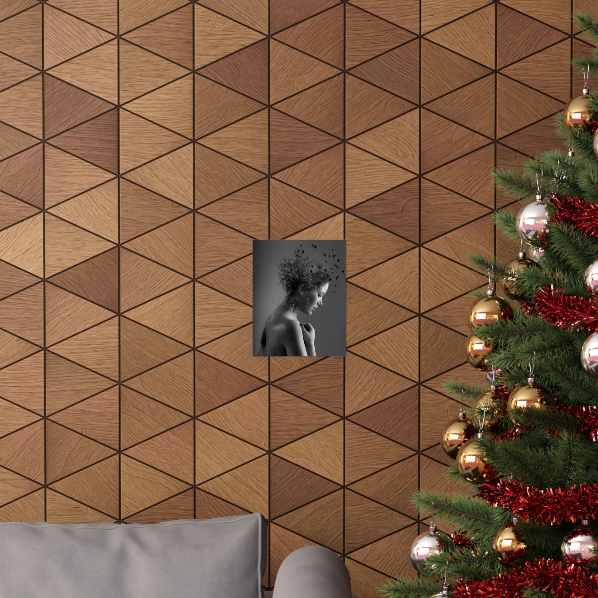 Wooden wall with geometric pattern, framed picture, and Christmas tree with decorations.