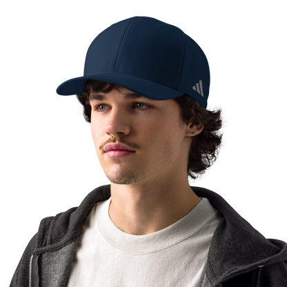 Man wearing a navy blue Adidas cap on a white background