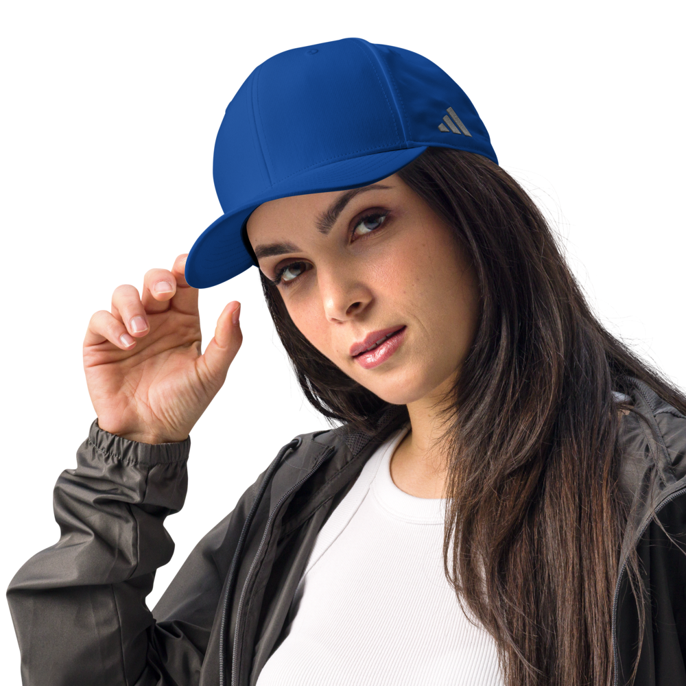 Woman wearing a blue Adidas cap on a white background