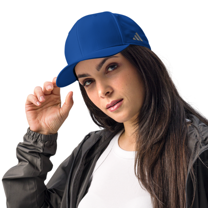 Woman wearing a blue Adidas cap on a white background