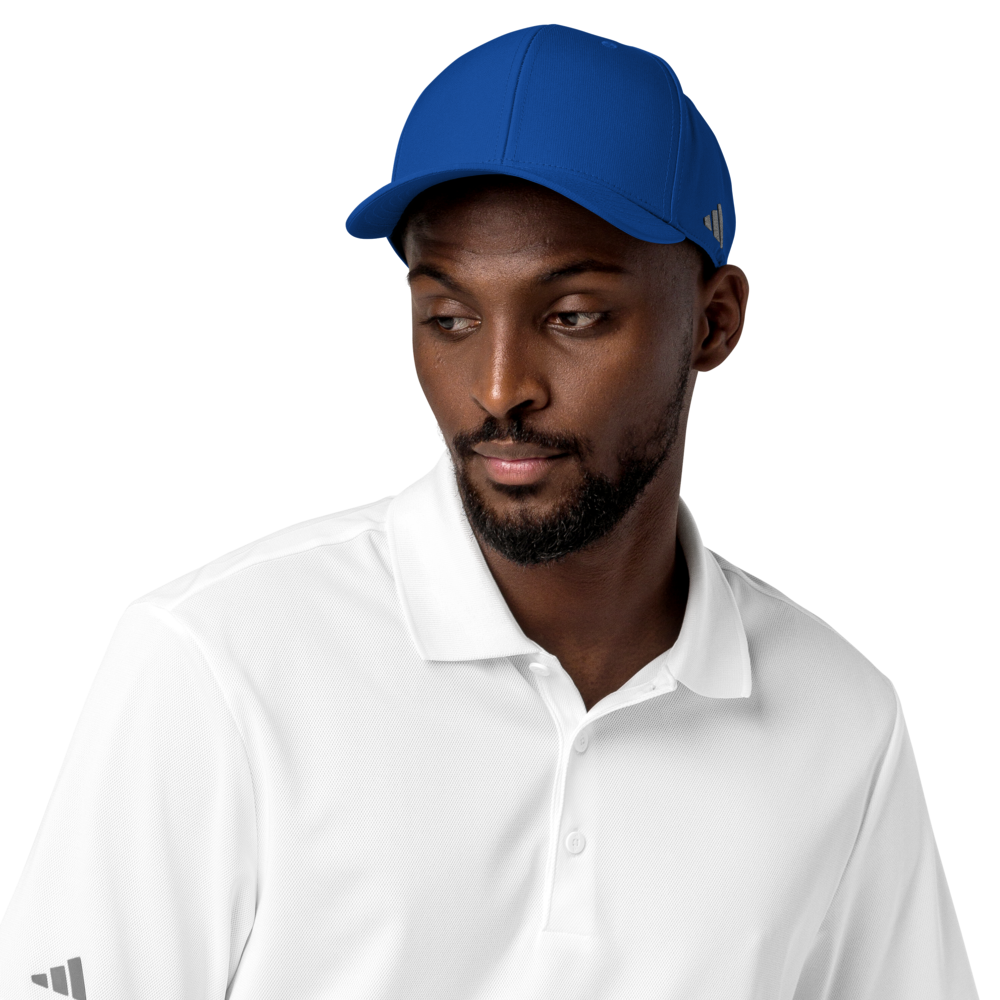 Man wearing a blue Adidas cap and white shirt on a white background