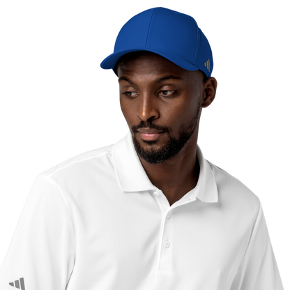 Man wearing a blue Adidas cap and white shirt on a white background