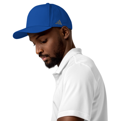 Man wearing a blue Adidas cap and white polo shirt on a white background