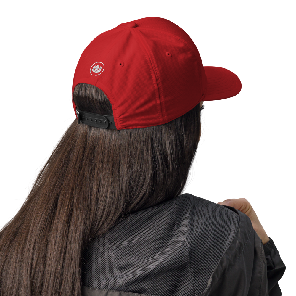 Person wearing a red cap with a logo on a white background