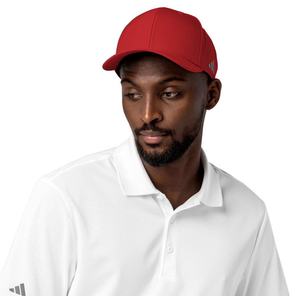 Man wearing a red cap and white shirt with Adidas logo on a white background