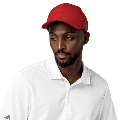 Man wearing a red cap and white shirt with Adidas logo on a white background