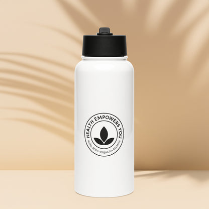 White water bottle with black lid and 'Health Empowers You' logo on a beige background