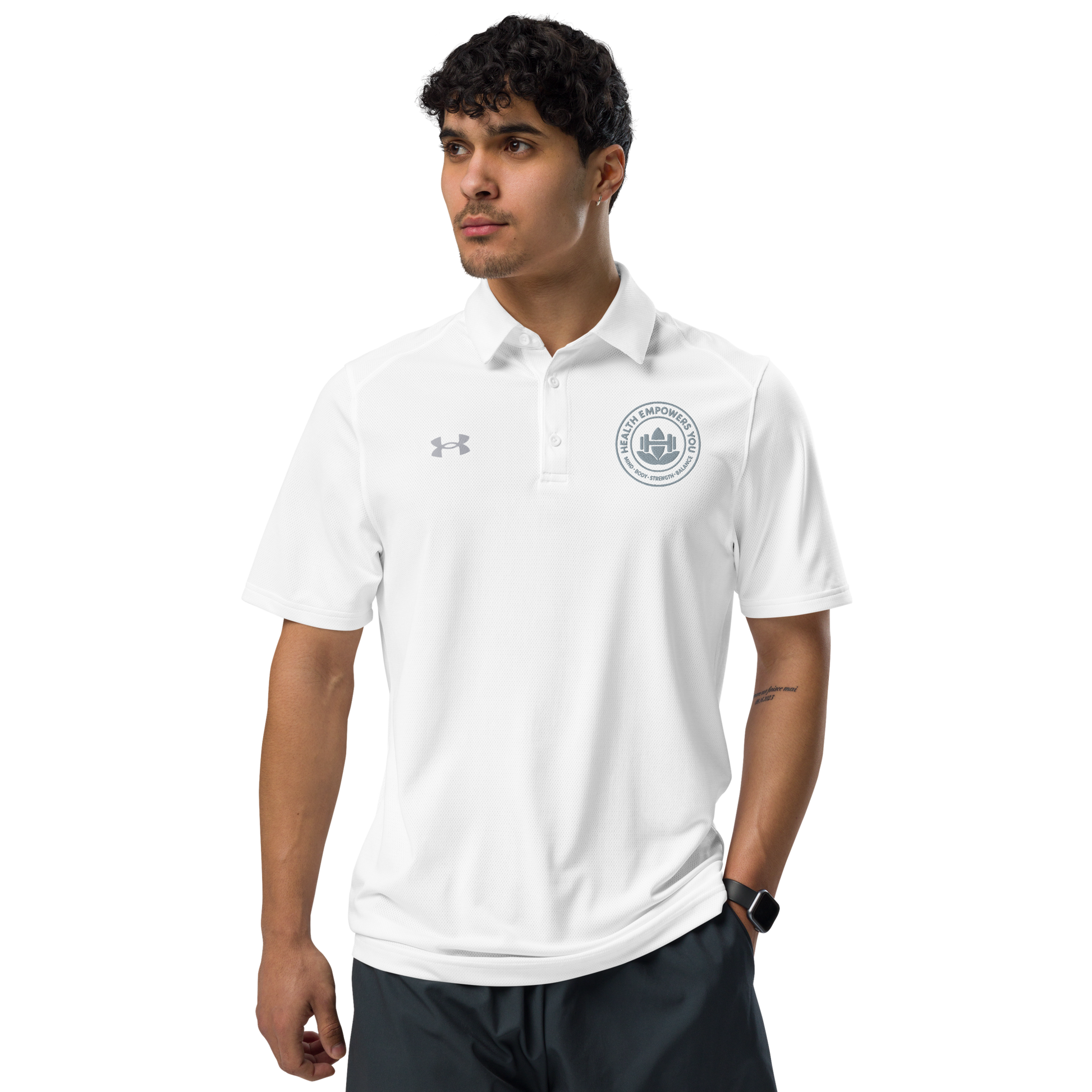 Man wearing a white polo shirt with a logo on a white background