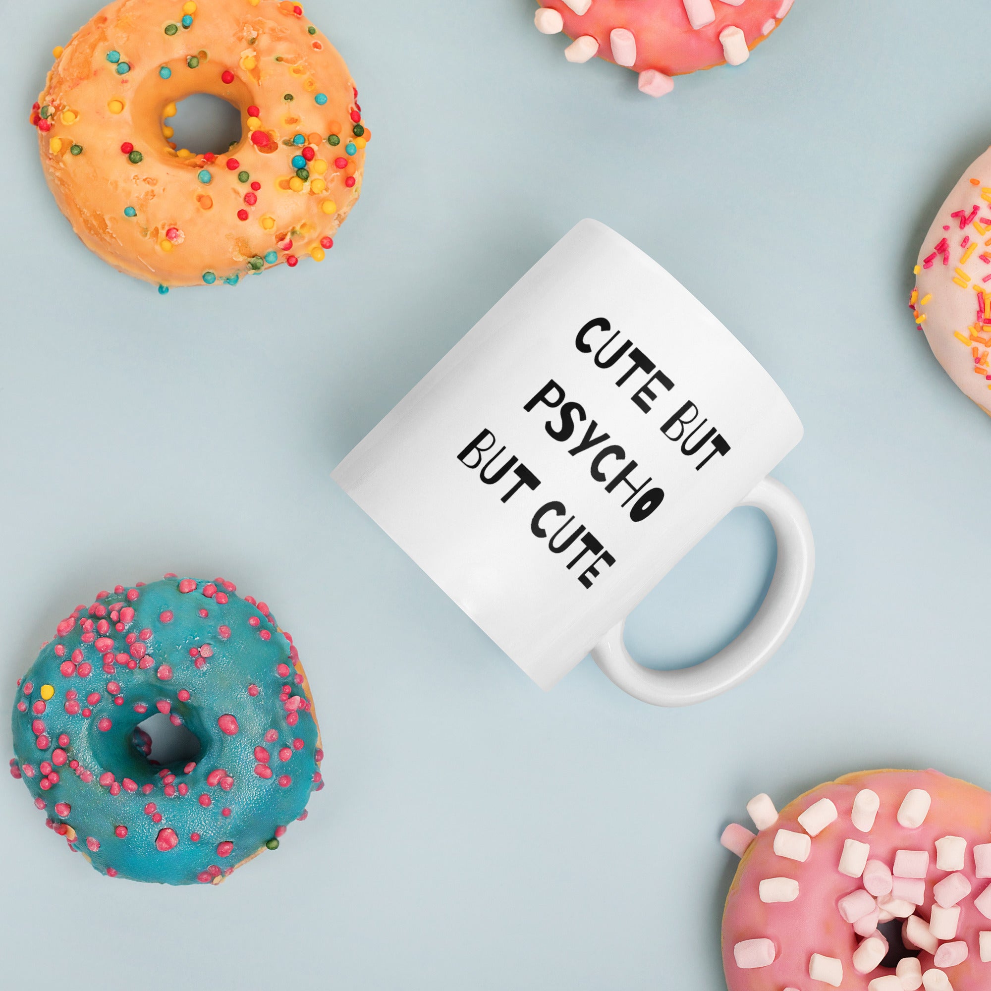 A white ceramic mug with the text &