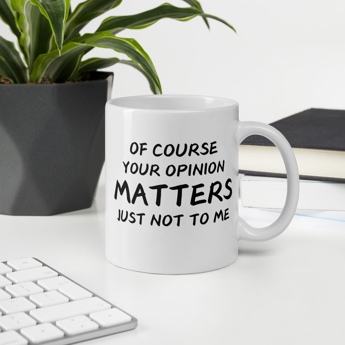 "White ceramic coffee mug with black text saying Of Course Your Opinion Matters Just Not to Me"